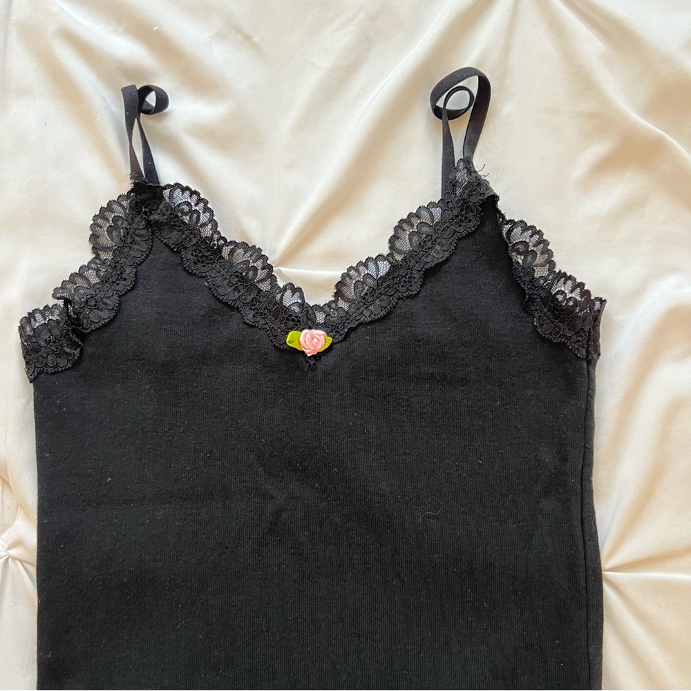 Black lace trim crop cami top with a cute pink rosette and adjustable straps